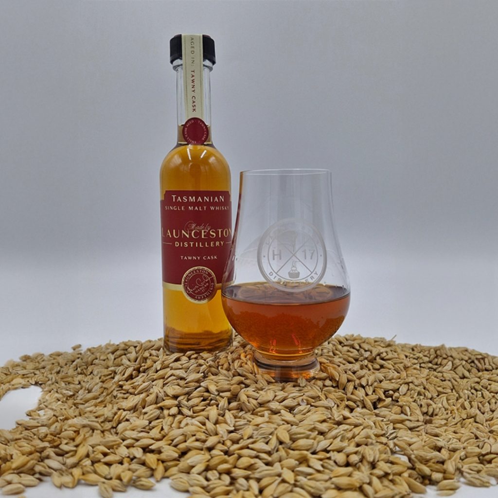 Bottle of whisky and glass